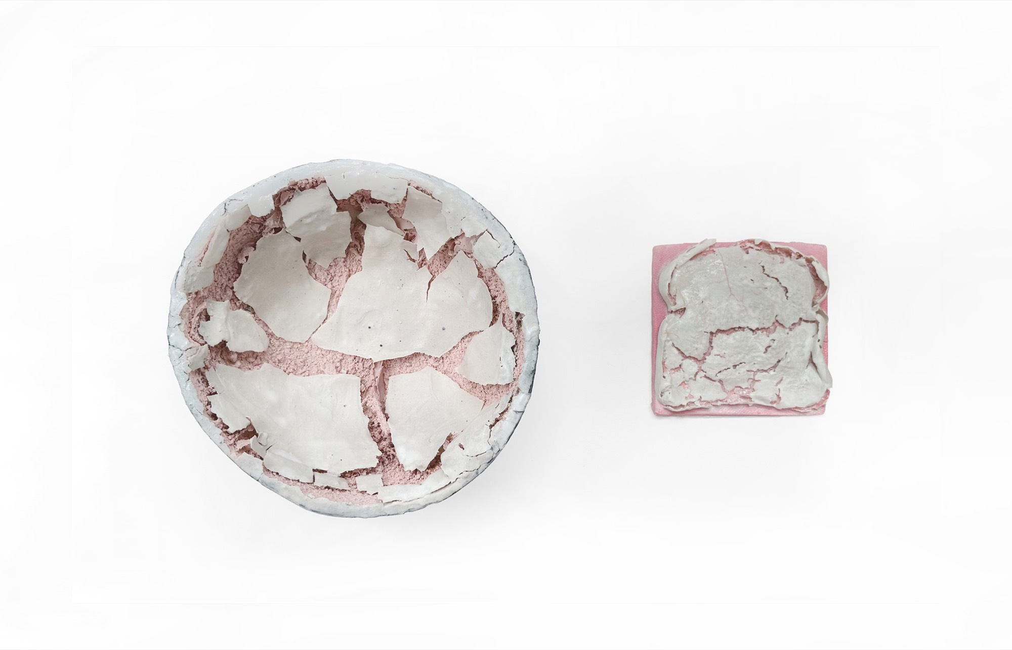 A Bowl and a Toast — a ceramic bowl and a slice of bread, both crusted with cracked white glaze over pink